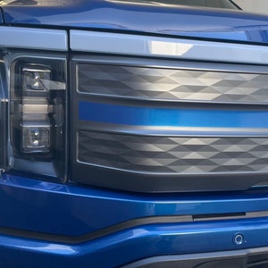 Grille Stripe Decal by LUDesignsNY Custom Created and Sized to fit a 2022-25 Ford F-150 Lightning.  Video Installation Included!