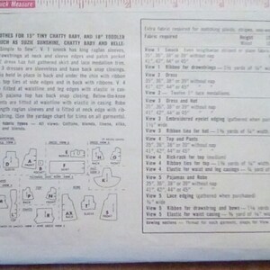 May include: A vintage sewing pattern for doll clothes, featuring a detailed diagram of the pattern pieces and a chart listing the fabric requirements for each garment. The pattern includes instructions for making dresses, tops, pants, and pajamas for dolls.