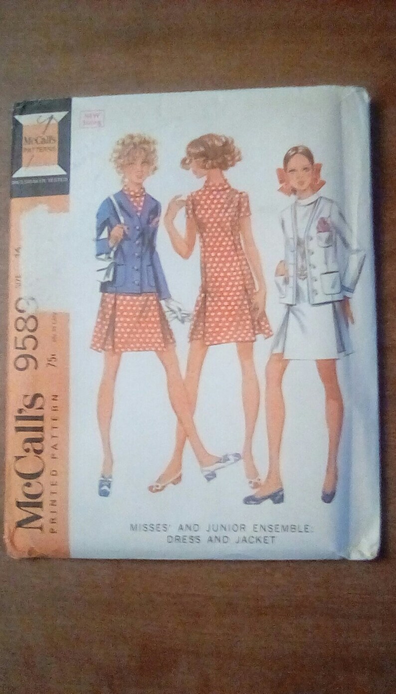 May include: Vintage McCall's sewing pattern number 9580 for a misses' and junior ensemble dress and jacket. The pattern features three women wearing the dress and jacket in different colors and patterns.