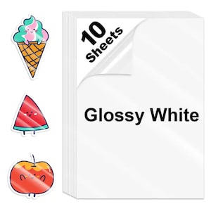 May include: A stack of ten glossy white sheets with the text "Glossy White" and "10 Sheets". The image also features three colorful stickers: an ice cream cone, a watermelon slice, and an apple, all with smiling faces.