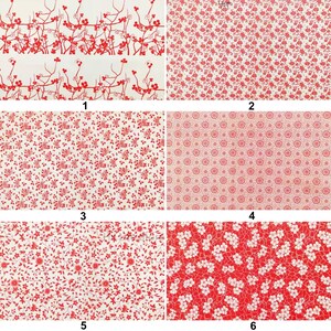 May include: A collection of six fabric swatches featuring various red and white floral patterns. Designs include branches with blossoms, small flowers, and intricate circular motifs. The fabrics are suitable for sewing, quilting, or crafting projects.