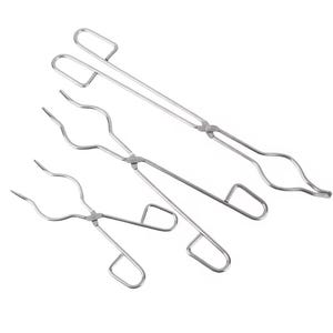 May include: Three stainless steel laboratory tongs of varying sizes are arranged diagonally. Each tong features a handle with a loop, a central pivot, and curved gripping ends. The metal has a shiny, reflective surface.