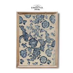 May include: A framed print of a vintage floral pattern in shades of blue and white on a cream background. The pattern features intricate floral designs and swirling vines.