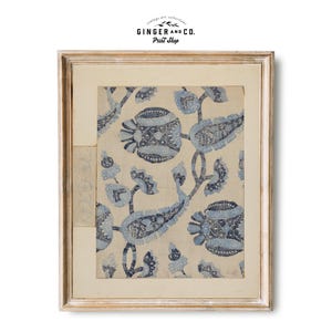 May include: A framed print of a vintage blue and white paisley pattern. The print is in a light wood frame with a white mount.