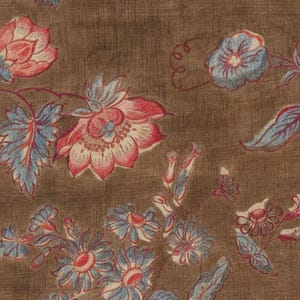May include: A brown fabric with a floral pattern. The flowers are in shades of pink, red, blue, and white. The fabric has a textured surface.
