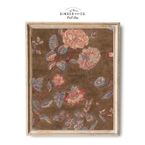 May include: A framed print of a vintage floral pattern with pink, red, and blue flowers on a brown background. The print is in a white wood frame.