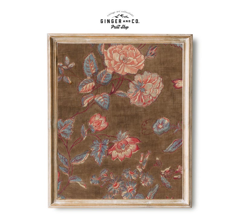 May include: A framed print of a vintage floral pattern with pink, red, and blue flowers on a brown background. The print is in a white wood frame.