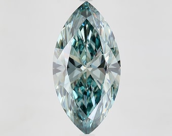 May include: A marquise-cut gemstone in a light teal colour. The gem has many facets that reflect light, creating a sparkling effect. The elongated shape is symmetrical, with pointed ends and a rounded centre. The gemstone is set against a plain white background.