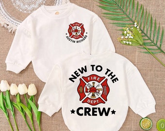 May include: Two white long-sleeved shirts with a red and black fire department logo. The top shirt has the text "Austin Richard Fire Dept." and the bottom shirt has the text "New to the Crew".