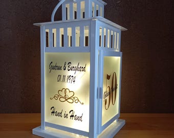 Personalized lantern with the saying "Hand in Hand" for a wedding anniversary. Gift for a golden wedding anniversary, diamond wedding anniversary, or silver wedding anniversary.