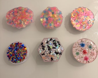 Phone pop socket with cute designs on top in uv resin ..