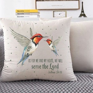 May include: A white throw pillow with a beige background featuring two colourful hummingbirds and the text "AS FOR ME AND MY HOUSE, WE WILL serve the Lord Joshua 24:15".