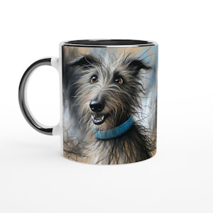 May include: White ceramic mug featuring a detailed illustration of a smiling dog with shaggy fur and a blue collar. The mug has a black handle and rim, set against a white background. The dog's expression is friendly and inviting.