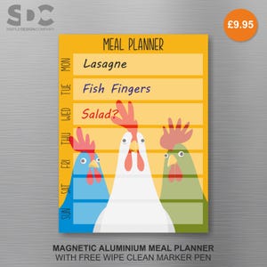 May include: A yellow magnetic meal planner with a chicken theme. The planner has the days of the week listed on the left and meal suggestions for each day. The bottom of the planner reads "MAGNETIC ALUMINIUM MEAL PLANNER WITH FREE WIPE CLEAN MARKER PEN."