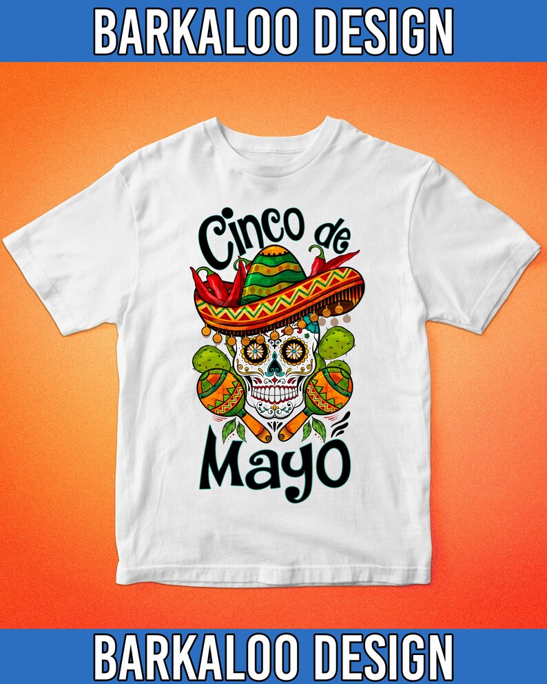 May include: White t-shirt with a colorful graphic design featuring a sugar skull wearing a sombrero, chili peppers, and maracas. The text "Cinco de Mayo" is printed below the skull.