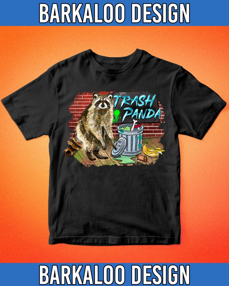 May include: Black t-shirt with a graphic of a raccoon standing next to a trash can with the text "Trash Panda" above it.