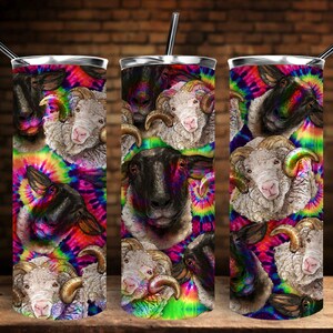 May include: A stainless steel tumbler with a colorful tie-dye pattern featuring a repeating design of sheep with different colored fur. The sheep are facing forward with their horns visible.