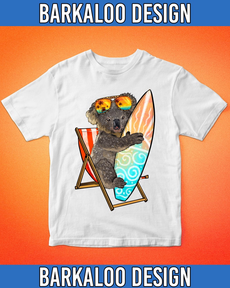May include: White t-shirt with a graphic of a koala wearing sunglasses and holding a surfboard. The koala is sitting in a beach chair. The graphic is in a cartoon style.