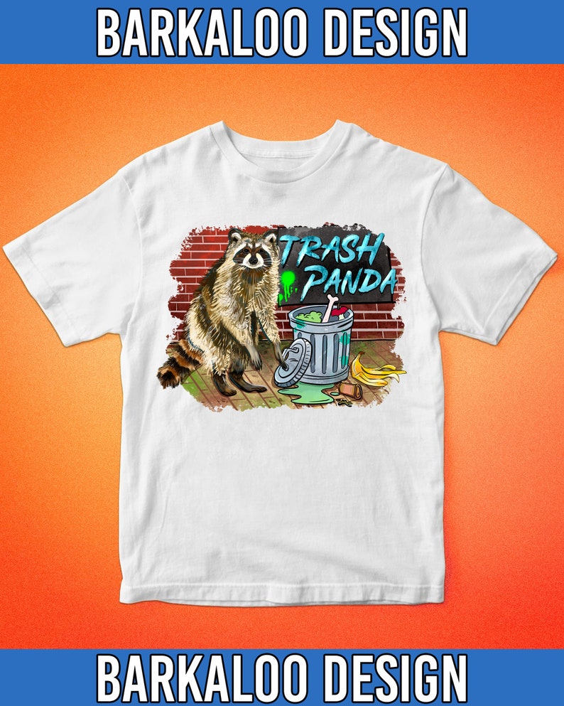 May include: White t-shirt with a graphic of a raccoon standing next to a trash can. The trash can has a sign that says "Trash Panda".