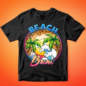 May include: Black t-shirt with a graphic of a beach scene with palm trees, waves, and the text "Beach Bum" in a colorful retro font.