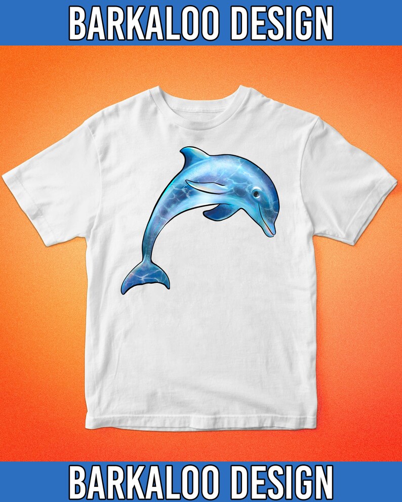 May include: White t-shirt with a blue dolphin jumping out of the water. The dolphin is detailed with blue and white water patterns.