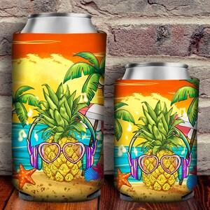 May include: Two colorful can coolers with a pineapple wearing sunglasses and headphones on a beach scene. The pineapple is on a beach with palm trees, an umbrella, and a starfish. The can coolers are orange, yellow, blue, and green.