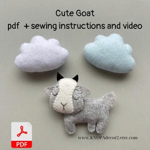 May include: A PDF pattern for sewing a cute gray felt goat with white facial features. The pattern includes sewing instructions and a video tutorial. The image also shows two felt clouds, one white and one light blue.