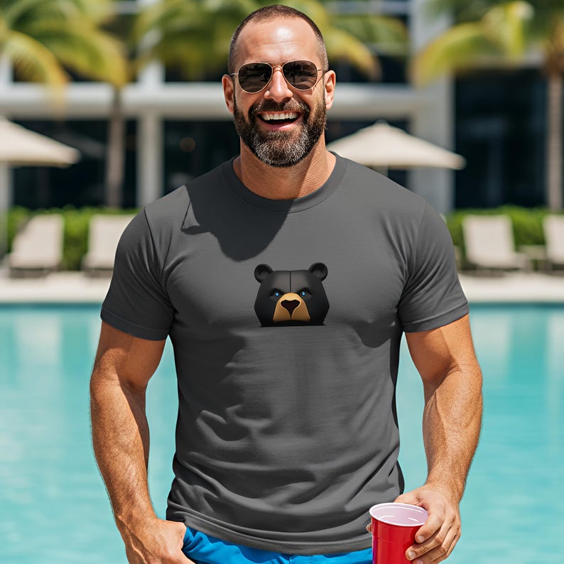 Show off your strength and pride with this dark grey shirt featuring a fierce black bear with piercing blue eyes. Perfect for gay bear lovers, this bold bear pride outfit lets you stand out in style. This subtle bear pride shirt for men makes the perfect gay man gift this season.