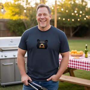 Embrace your strength with this navy bear pride shirt, featuring a fierce black bear with piercing blue eyes. Perfect for showing off your pride and identity, this gay bear tshirt makes an ideal subtle pride gift for yourself or a loved one.