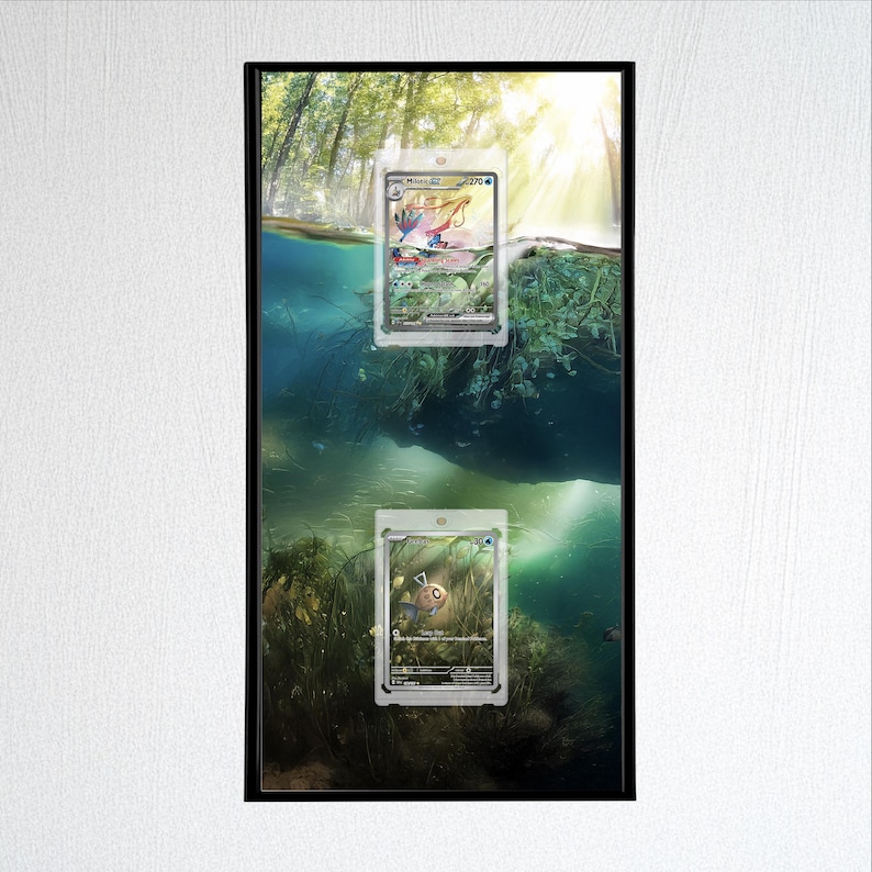 May include: Framed artwork featuring two Pok&eacute;mon trading cards in protective sleeves. The background depicts a serene underwater scene with sunlight filtering through the water. The cards are visible, showcasing their unique designs and colors.