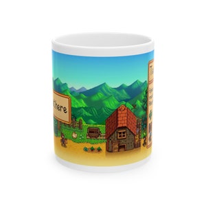 May include: A white ceramic mug featuring a pixelated image of a farm scene from the video game Stardew Valley. The image depicts a small house, a farmer riding a horse, and a field of crops. The text "Start here" is visible on a sign in the background.