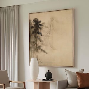 Oversized framed canvas print of a Japanese sumi-e pine tree painting, mounted in a contemporary living room with neutral-toned decor. The minimalist Asian artwork enhances the serene and harmonious ambiance.