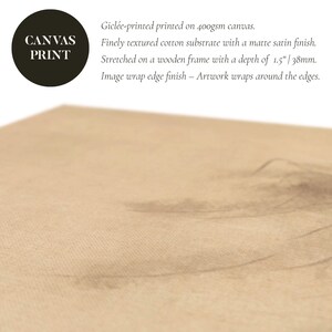 Close-up of a wabi-sabi-inspired canvas print showcasing a finely textured cotton surface with subtle earthy tones and minimalist pine tree sketch details.