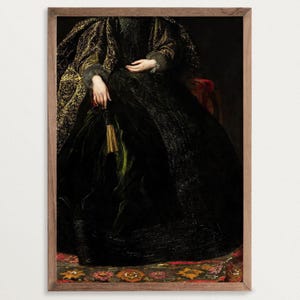 A framed art print depicting the lower half of a seated woman in a richly detailed black and gold embroidered gown. Her hands rest on her lap, holding a tassel. The frame is made of wood, enhancing the classic aesthetic of the artwork