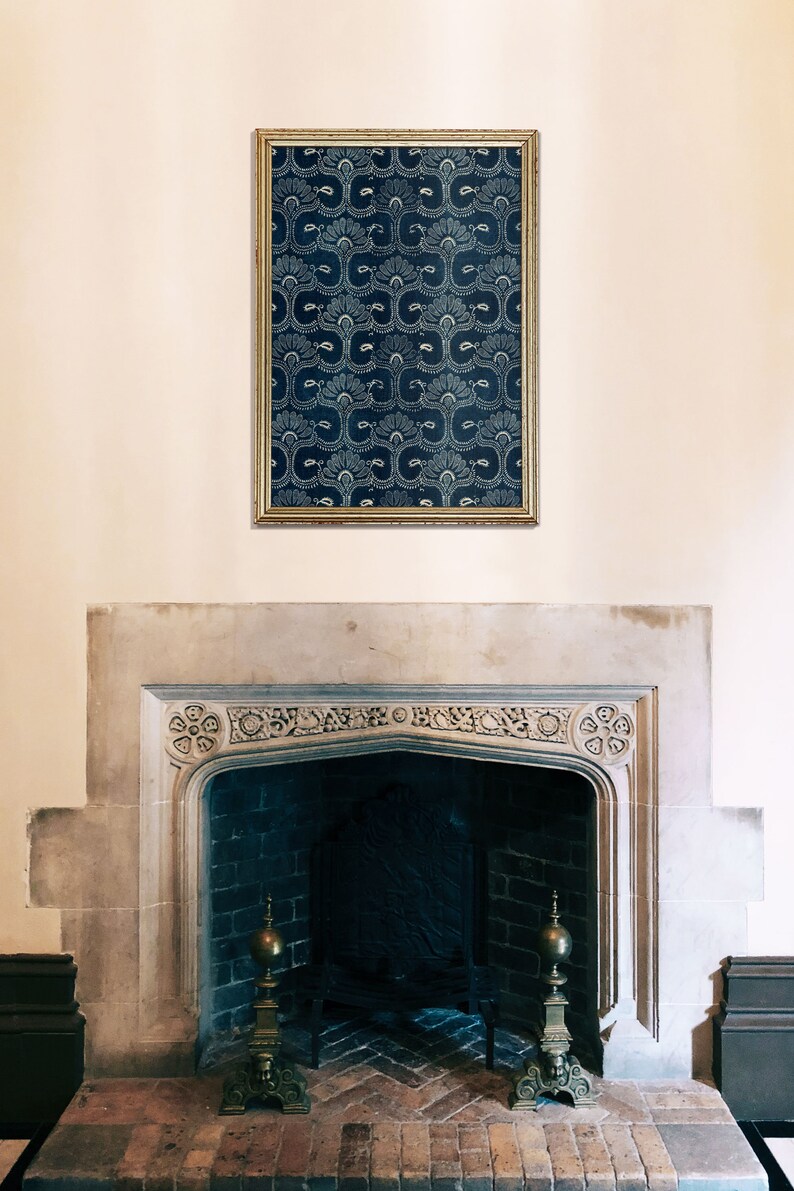 May include: A stone fireplace with a dark brick interior and two ornate brass andirons. A framed print with a blue and white geometric pattern hangs above the fireplace.