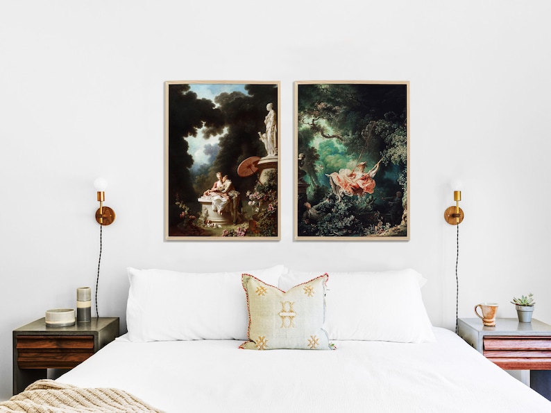 May include: Two framed paintings depicting scenes from nature. The painting on the left shows a woman sitting on a stone bench in a lush green forest. The painting on the right shows a woman swinging on a rope swing in a forest.