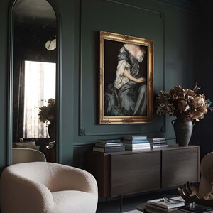 Framed Baroque portrait art print displayed on a dark green wall in a moody living room. Surrounded by sculptural furniture and dried florals, the artwork adds depth and vintage charm to modern interiors.