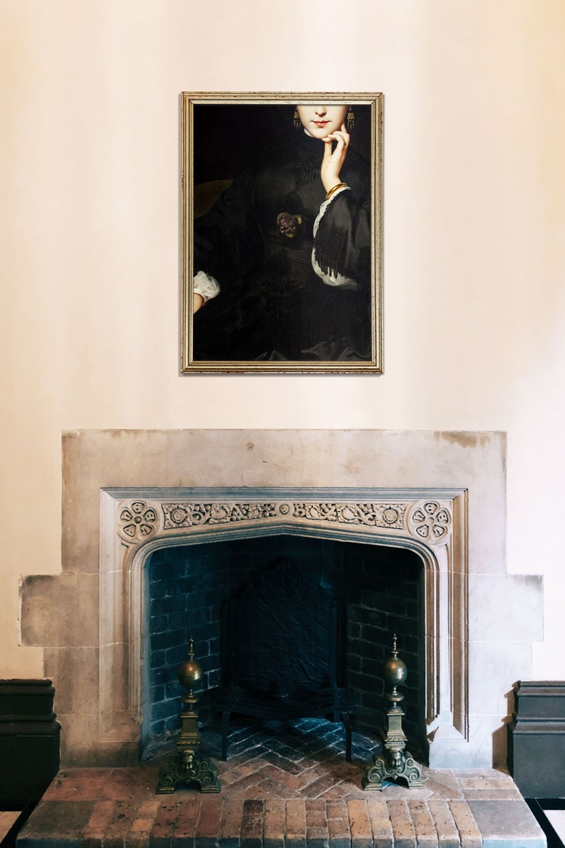 May include: A framed portrait of a woman in a black dress with a white collar, she is looking to the side and has her hand on her chin. The portrait is hanging on a white wall above a fireplace.