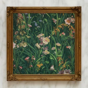 Framed wildflower meadow painting with ornate gold frame, leaning against a white marble wall, highlighting the classic style of the botanical artwork.