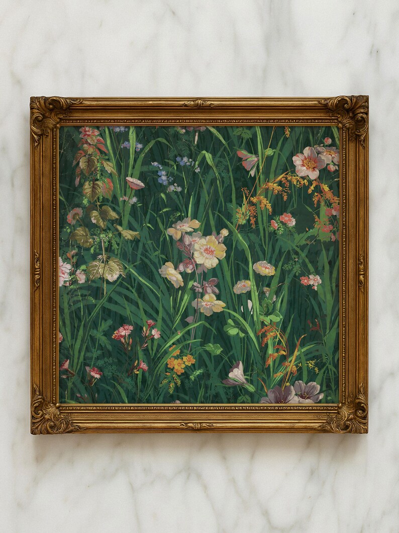 Framed wildflower meadow painting with ornate gold frame, leaning against a white marble wall, highlighting the classic style of the botanical artwork.