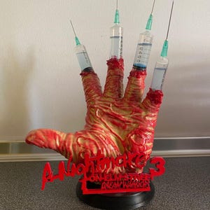 A Nightmare on Elm Street 3 Freddy Syringe Hand Prop – Life-Size 1:1 Display Replica