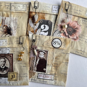 May include: Four vintage envelopes with various embellishments, including a small portrait, the number "2", a flower, and a man's portrait. The envelopes have handwritten text, numbers, and dates. One envelope has the text "Overdue" and "8%".