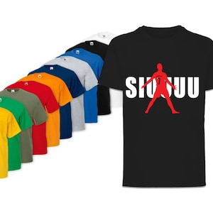 May include: A black t-shirt with a white silhouette of a soccer player with the number 7 on the back and the word "SIUUU" printed in white letters.