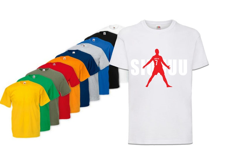 May include: A white t-shirt with a red silhouette of a soccer player with the number 7 on the back and the word "SIUU" printed in white letters.