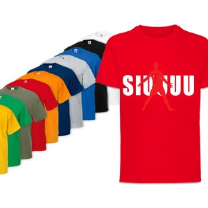 May include: A variety of t-shirts in different colors, including yellow, green, red, orange, blue, and grey. One t-shirt is red with a white silhouette of a person playing basketball and the text "SHUU" in white.
