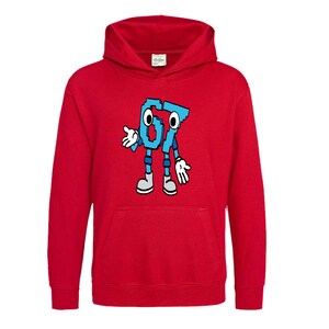 May include: A red hooded sweatshirt featuring a cartoon graphic of the number "67" in blue with black outlines. The "67" has arms, legs, and a face. The sweatshirt has a front pocket and a drawstring hood.