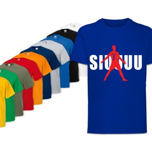 May include: A collection of t-shirts in various colors, including yellow, green, red, orange, and blue. The t-shirts feature a silhouette of a soccer player with the word "SIUUU" printed in white.