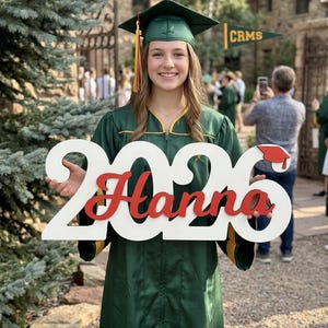 graduation celebration display with wooden decor sign