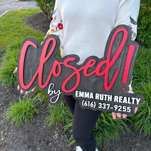 wooden sold sign with agent name for Instagram photo