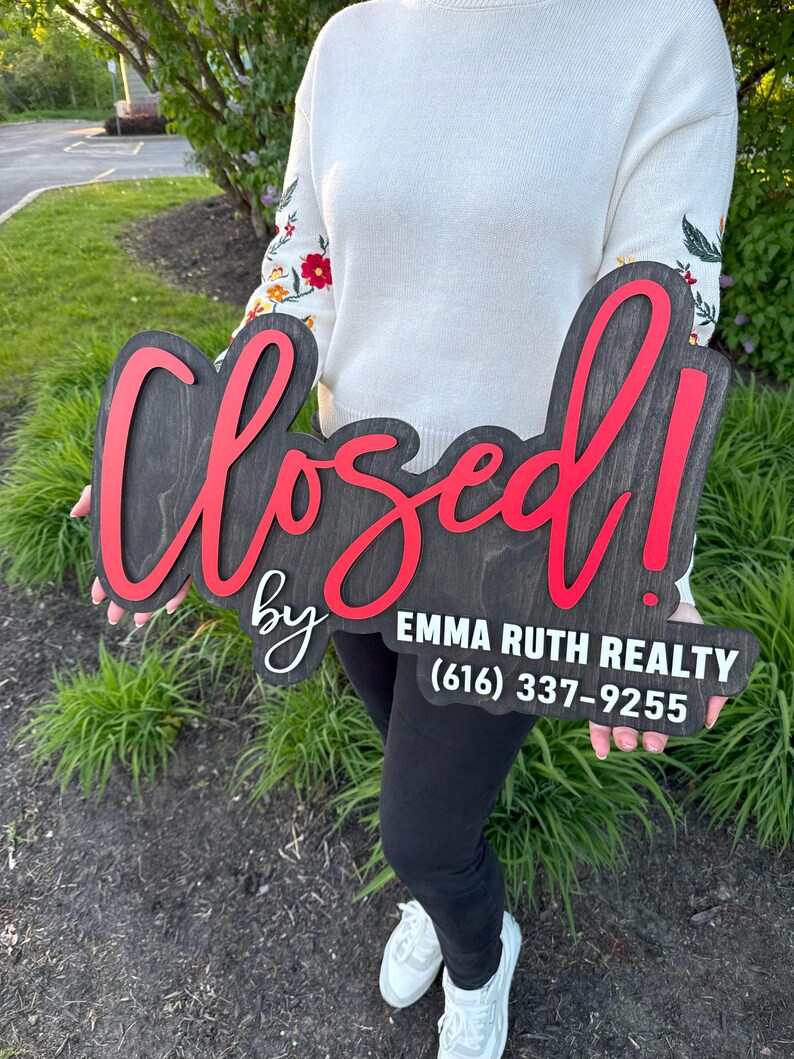 wooden sold sign with agent name for Instagram photo